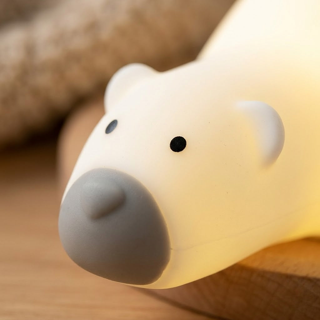 Veilleuse ours allongé sur le ventre